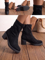 Detalles de las botas negras: cremallera interior, suela y caña